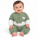 Baby in sage green teddy outfit.png.webp